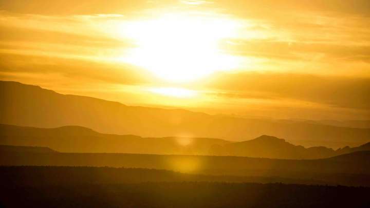 Depiction of hot weather with golden sun setting
